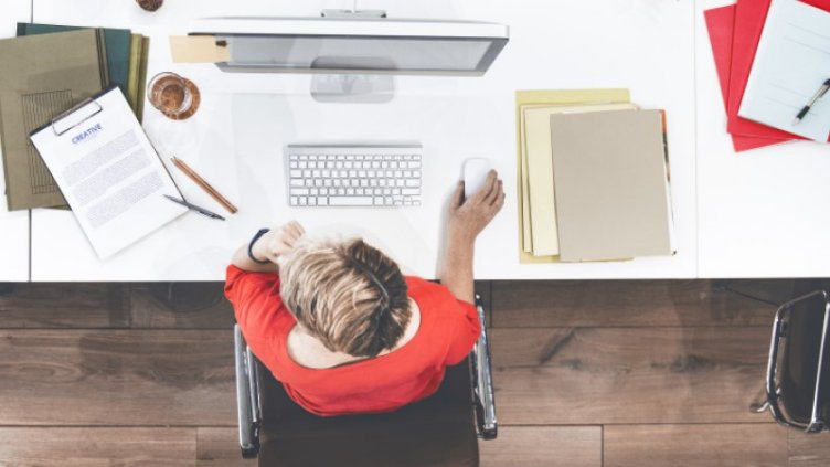 Top view shot of a man working on a desktop