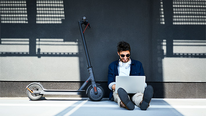 Man sitting on a floor and using laptop