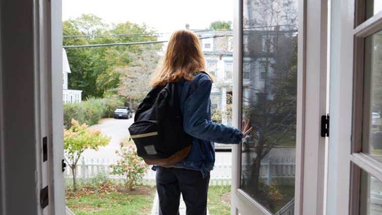 A girl standing near the door