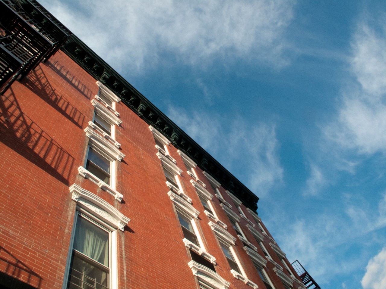 Perspective of red brick facade of residential building in Manhattan, New York City