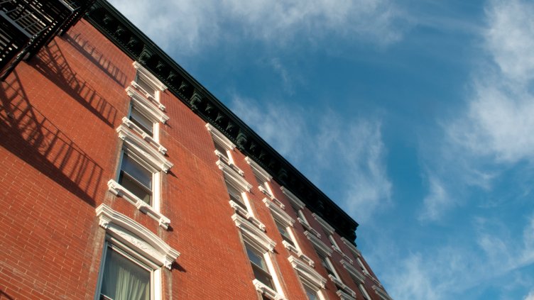 Perspective of red brick facade of residential building in Manhattan, New York City