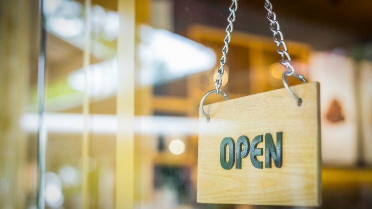 Open sign door in the coffe shop.