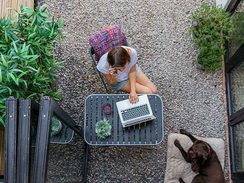 A lady working from home on laptop due to COVID-19