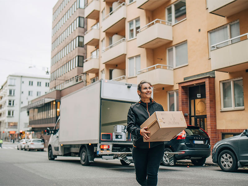 A female with a logistics box going to deliver some goods